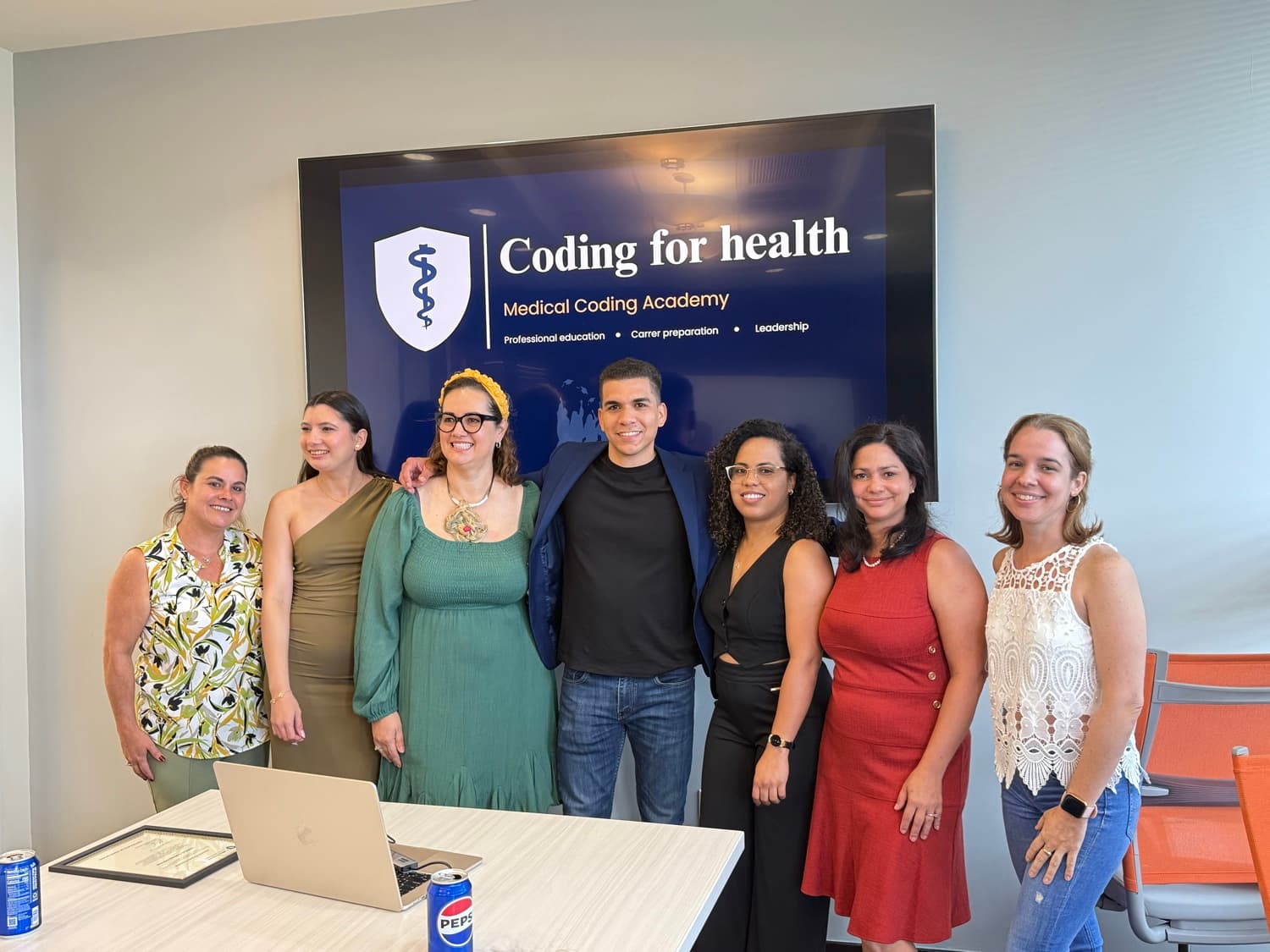 The Codingforhealth team in front of the program screen